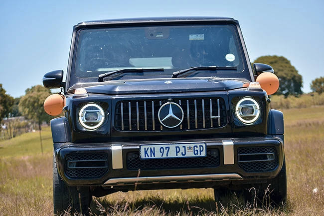 Bride and groom walking down the aisle at village wedding